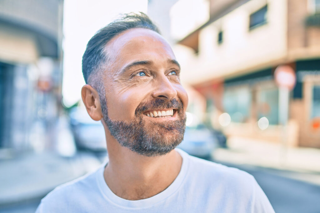 Man smiles after learning signs his body may need a detox