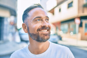 Man smiles after learning signs his body may need a detox