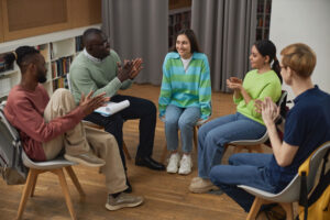 People sit in circle and discuss benefits of a cocaine detox program